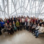 A group of people in a well-lit atrium space