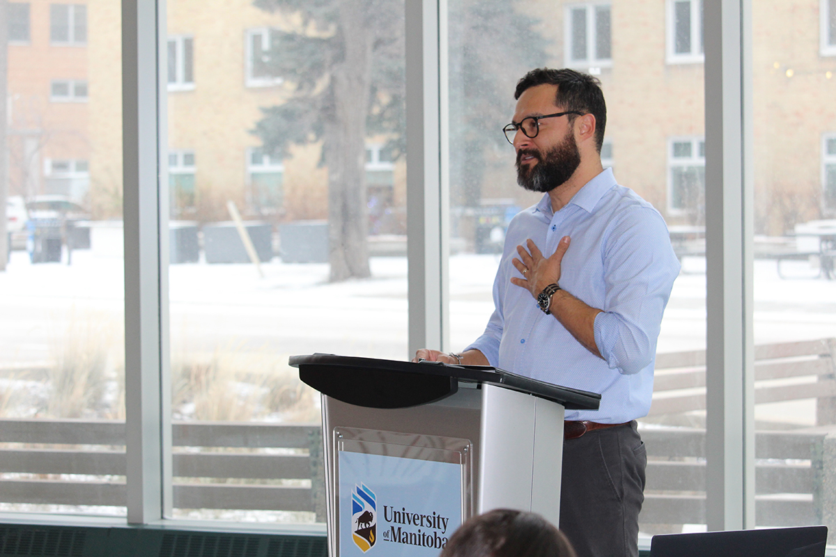 Edgar French speaks at a podium on Bannatyne campus.